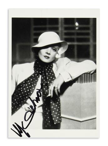 DIETRICH, MARLENE. Group of 3 Photographs Signed, each showing her holding a cigarette and looking into the camera.
